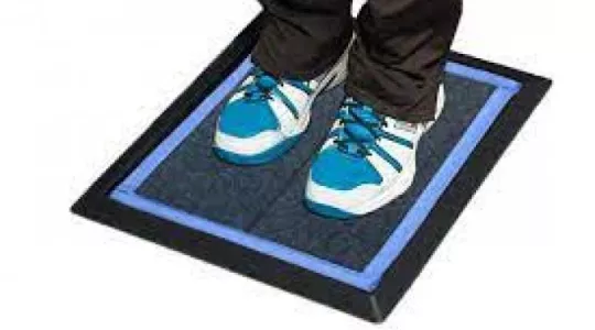 person standing on mat