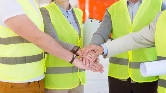 City workers holding hands